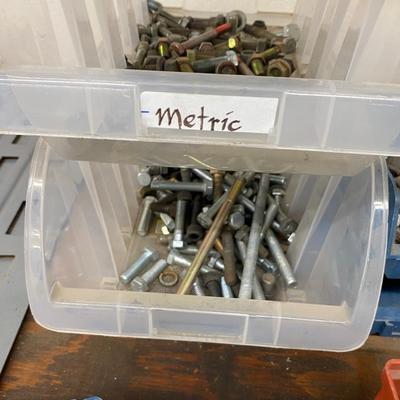 Organizing bins with a large variety of fasteners and other miscellaneous items