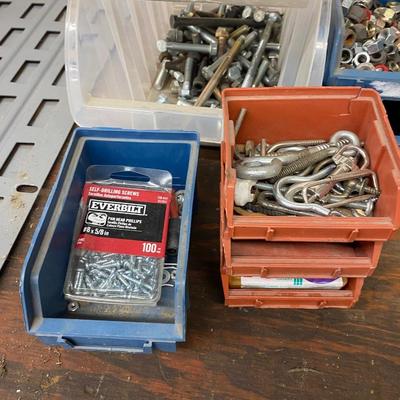 Organizing bins with a large variety of fasteners and other miscellaneous items