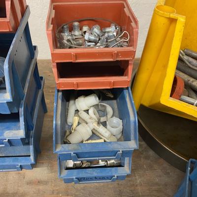 Organizing bins with a large variety of fasteners and other miscellaneous items