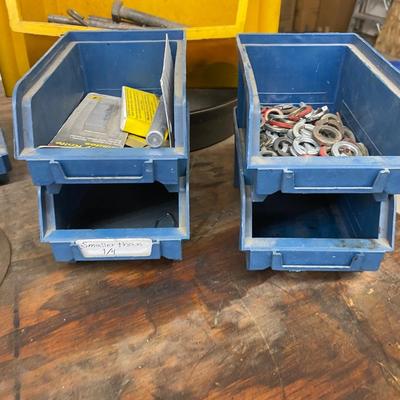 Organizing bins with a large variety of fasteners and other miscellaneous items