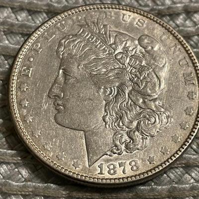 1878-P 7TF EXTRA FINE/AU CONDITION CLEANED MORGAN SILVER DOLLAR AS PICTURED.