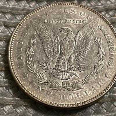 1878-P 7TF EXTRA FINE/AU CONDITION CLEANED MORGAN SILVER DOLLAR AS PICTURED.