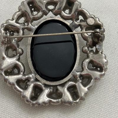 Vintage black glass cameo brooch