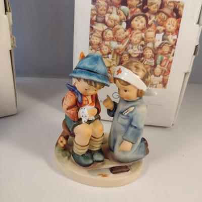 Pair of Hummel Figurines- 'Little Nurse' and 'Merry Wanderer'