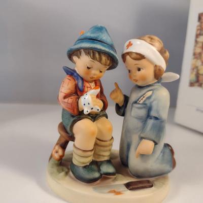 Pair of Hummel Figurines- 'Little Nurse' and 'Merry Wanderer'