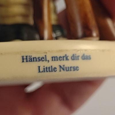 Pair of Hummel Figurines- 'Little Nurse' and 'Merry Wanderer'