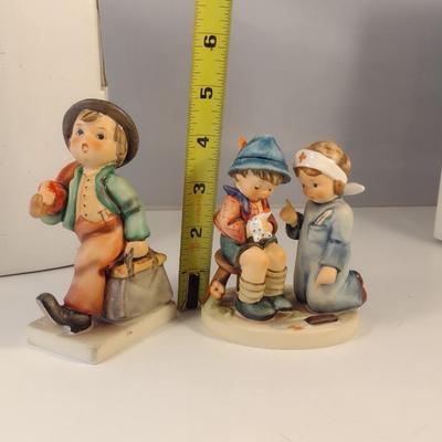 Pair of Hummel Figurines- 'Little Nurse' and 'Merry Wanderer'