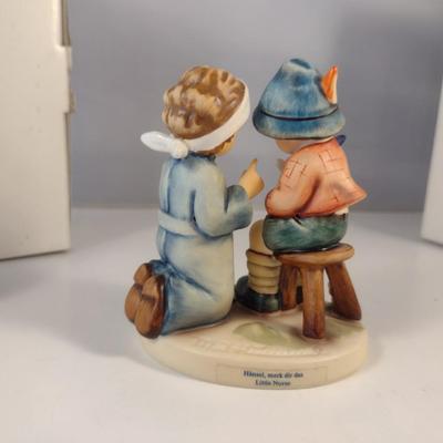 Pair of Hummel Figurines- 'Little Nurse' and 'Merry Wanderer'