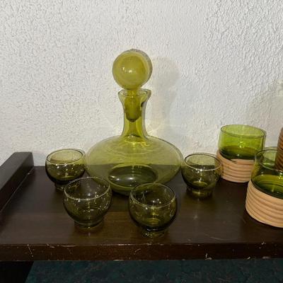 GREEN GLASS DECANTERS AND DRINKING GLASSES