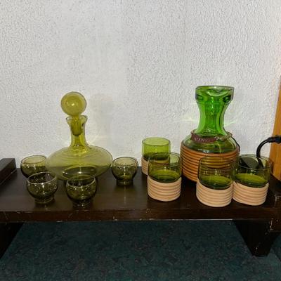 GREEN GLASS DECANTERS AND DRINKING GLASSES