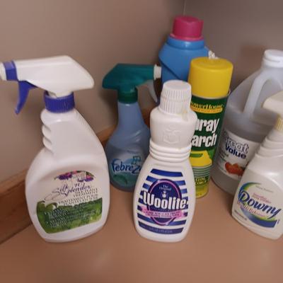 CLEANING SUPPLIES AND A LAUNDRY BASKET