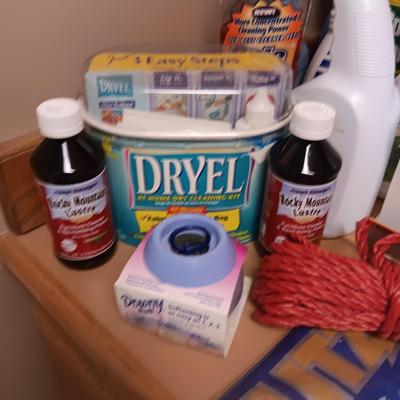 CLEANING SUPPLIES AND A LAUNDRY BASKET