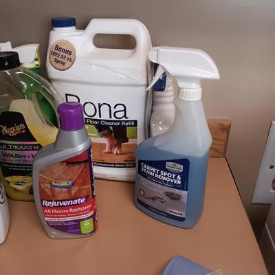 CLEANING SUPPLIES AND A LAUNDRY BASKET
