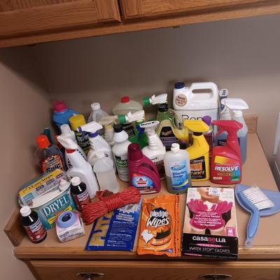 CLEANING SUPPLIES AND A LAUNDRY BASKET
