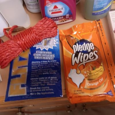 CLEANING SUPPLIES AND A LAUNDRY BASKET