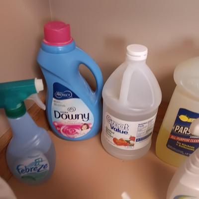 CLEANING SUPPLIES AND A LAUNDRY BASKET