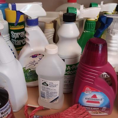 CLEANING SUPPLIES AND A LAUNDRY BASKET