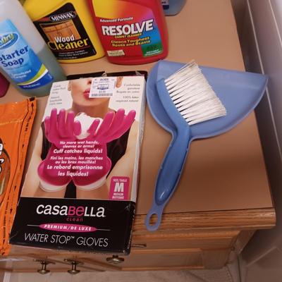 CLEANING SUPPLIES AND A LAUNDRY BASKET