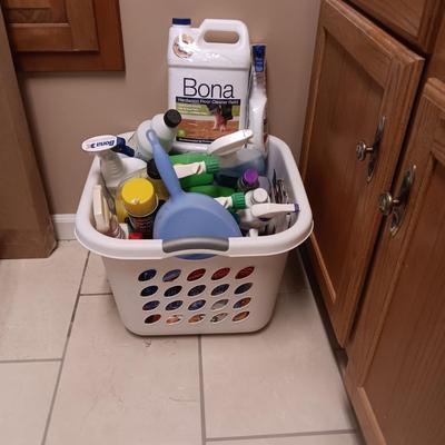 CLEANING SUPPLIES AND A LAUNDRY BASKET