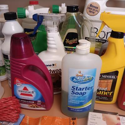 CLEANING SUPPLIES AND A LAUNDRY BASKET