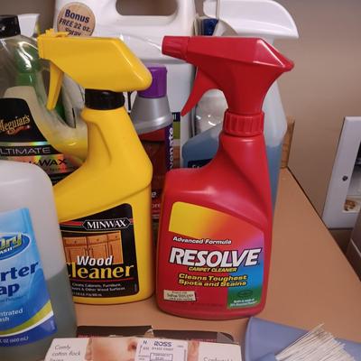 CLEANING SUPPLIES AND A LAUNDRY BASKET