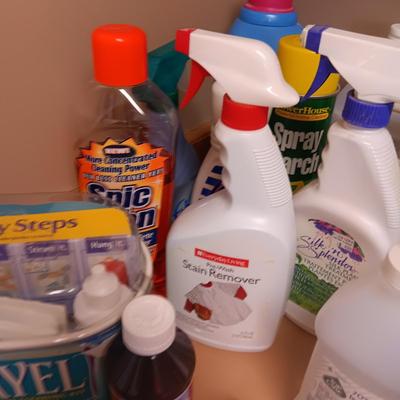 CLEANING SUPPLIES AND A LAUNDRY BASKET