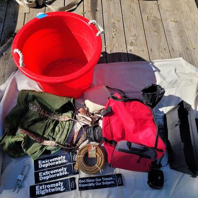 Lot of storage items, rope bumper stickers, canteen, tub