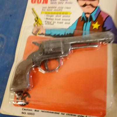 LOT 100 TWO TOY CAP GUNS