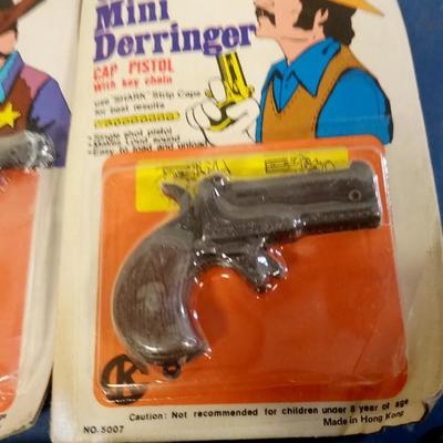 LOT 100 TWO TOY CAP GUNS