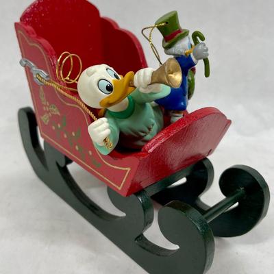 Disney characters Donald Duck ornaments with wood sleigh