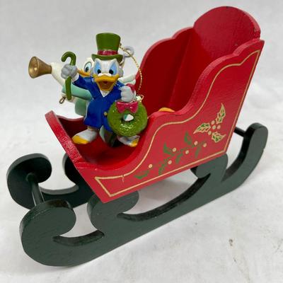 Disney characters Donald Duck ornaments with wood sleigh