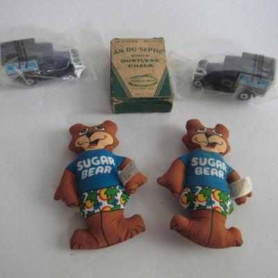 2 Kelloggs Toy Trucks, 2 Sugar Bear Dolls, Old Chalk Box With Small Chalk Pieces