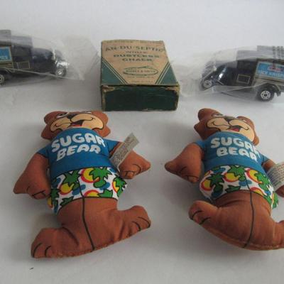 2 Kelloggs Toy Trucks, 2 Sugar Bear Dolls, Old Chalk Box With Small Chalk Pieces