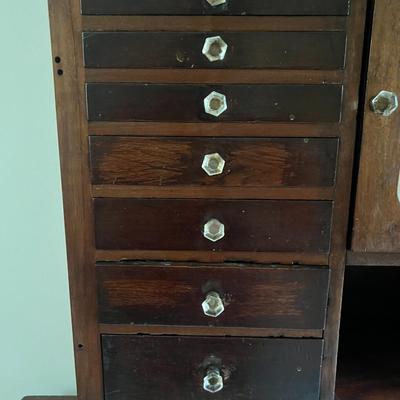 Antique Harvard Style Dental/Jewelry Cabinet with Crystal Knobs 33" Wide & 26" Tall in Good Preowned Condition.