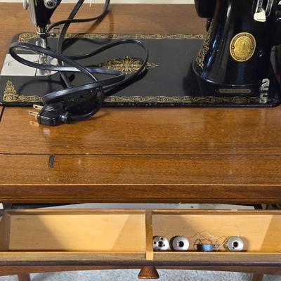 Singer Sewing Machine in Cabinet Table