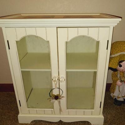 SWEET LITTLE DISPLAY CABINET, A WICKER CHAIR AND A PAPER MACHE DOLL