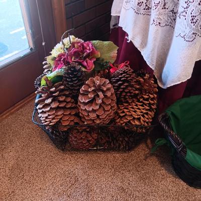 SILK FLOWER ARRANGEMENTS, PINECONES IN A METAL BASKET AND A ROUND TABLE