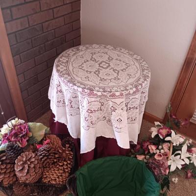 SILK FLOWER ARRANGEMENTS, PINECONES IN A METAL BASKET AND A ROUND TABLE