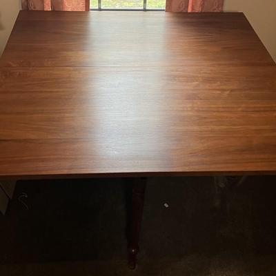 Vintage Wooden Drop Leaf Table 64" Long, 46" Wide, & 28.5" Tall in Good Preowned Condition.
