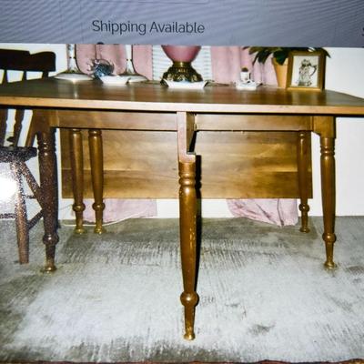Vintage Wooden Drop Leaf Table 64" Long, 46" Wide, & 28.5" Tall in Good Preowned Condition.