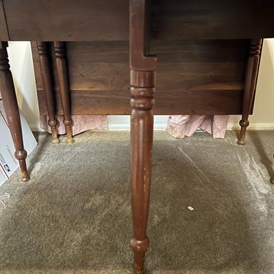 Vintage Wooden Drop Leaf Table 64" Long, 46" Wide, & 28.5" Tall in Good Preowned Condition.