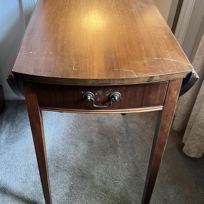 Antique Drop Leaf Oval Single Drawer Table as Pictured.
