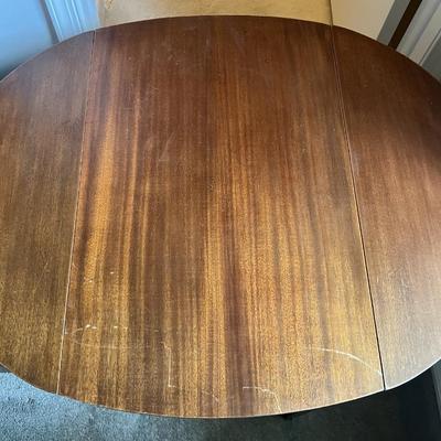 Antique Drop Leaf Oval Single Drawer Table as Pictured.