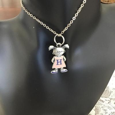 Girl charm on silver tone necklace