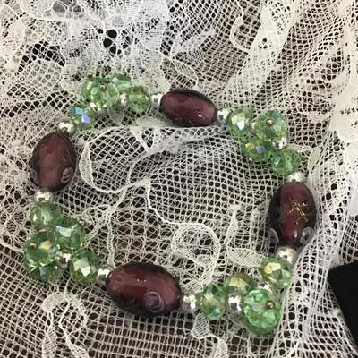Green crystal and purple glass with painted flowers bracelet
