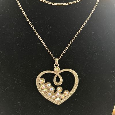 Women’s long heart, pendant, silver toned chain necklace