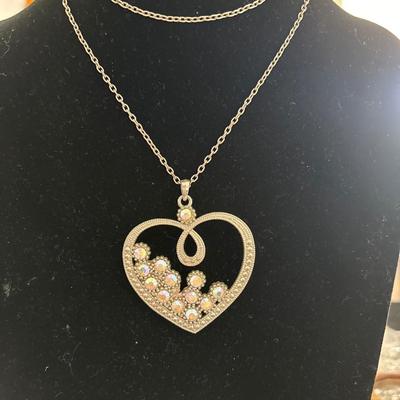 Women’s long heart, pendant, silver toned chain necklace