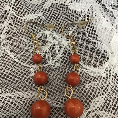 Orange beaded dangle earrings