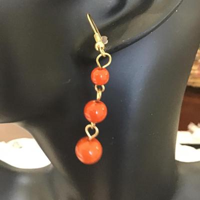 Orange beaded dangle earrings