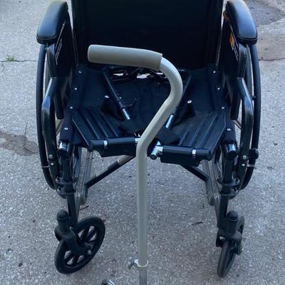 Everest and Jennings Wheelchair and a Cane